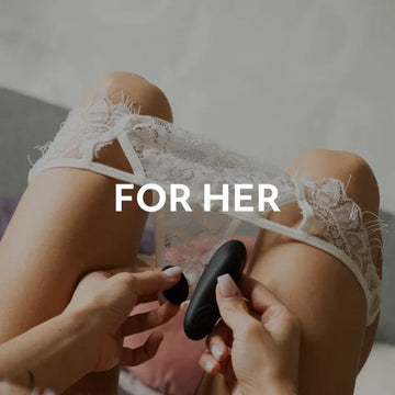 For Women toys showcased with a woman holding a black vibrator while wearing lace underwear.