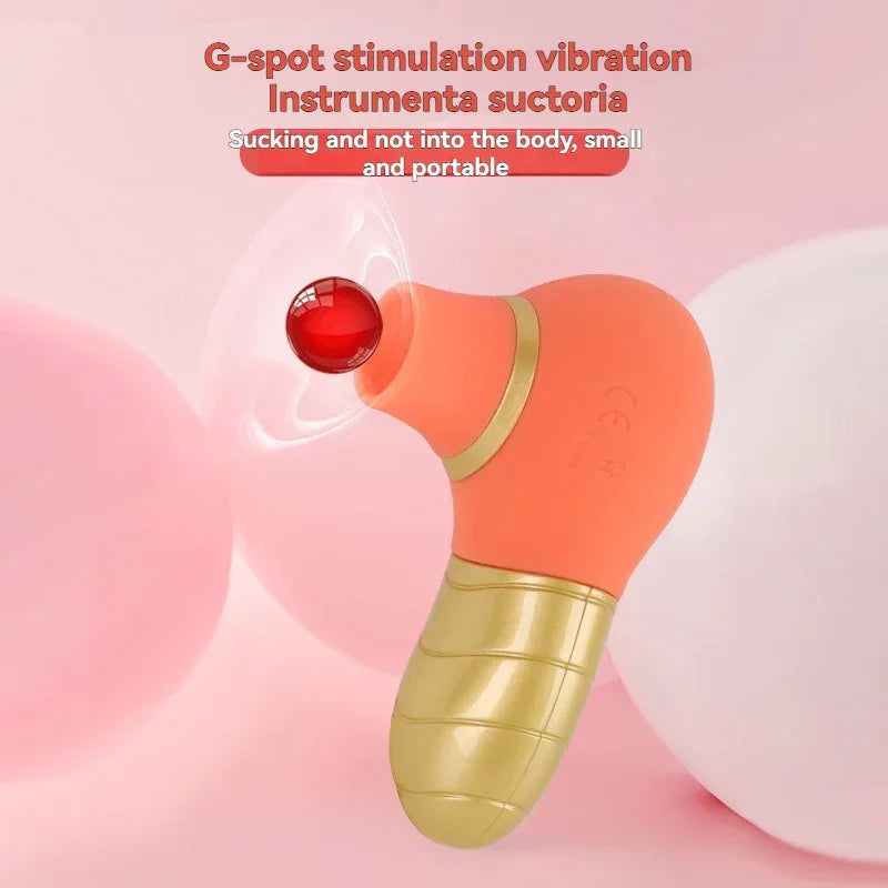 Orange and gold G-spot stimulation vibrator with suction design, small and portable on pink background.