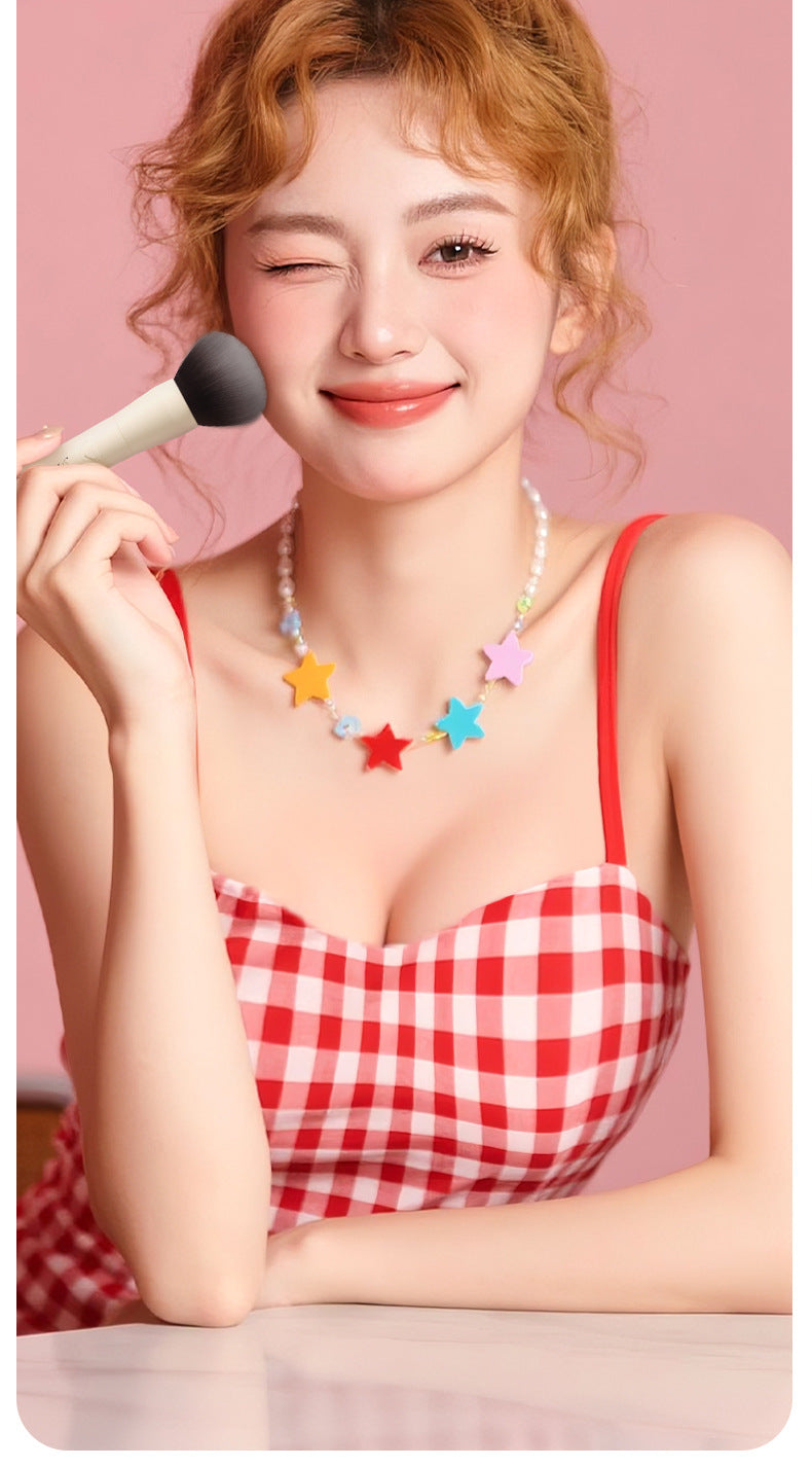 Woman Holding Makeup Brush Vibrator